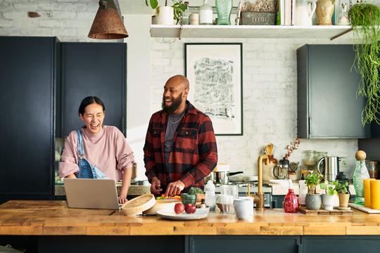 Couple cooking and food prepping in the kitchen
